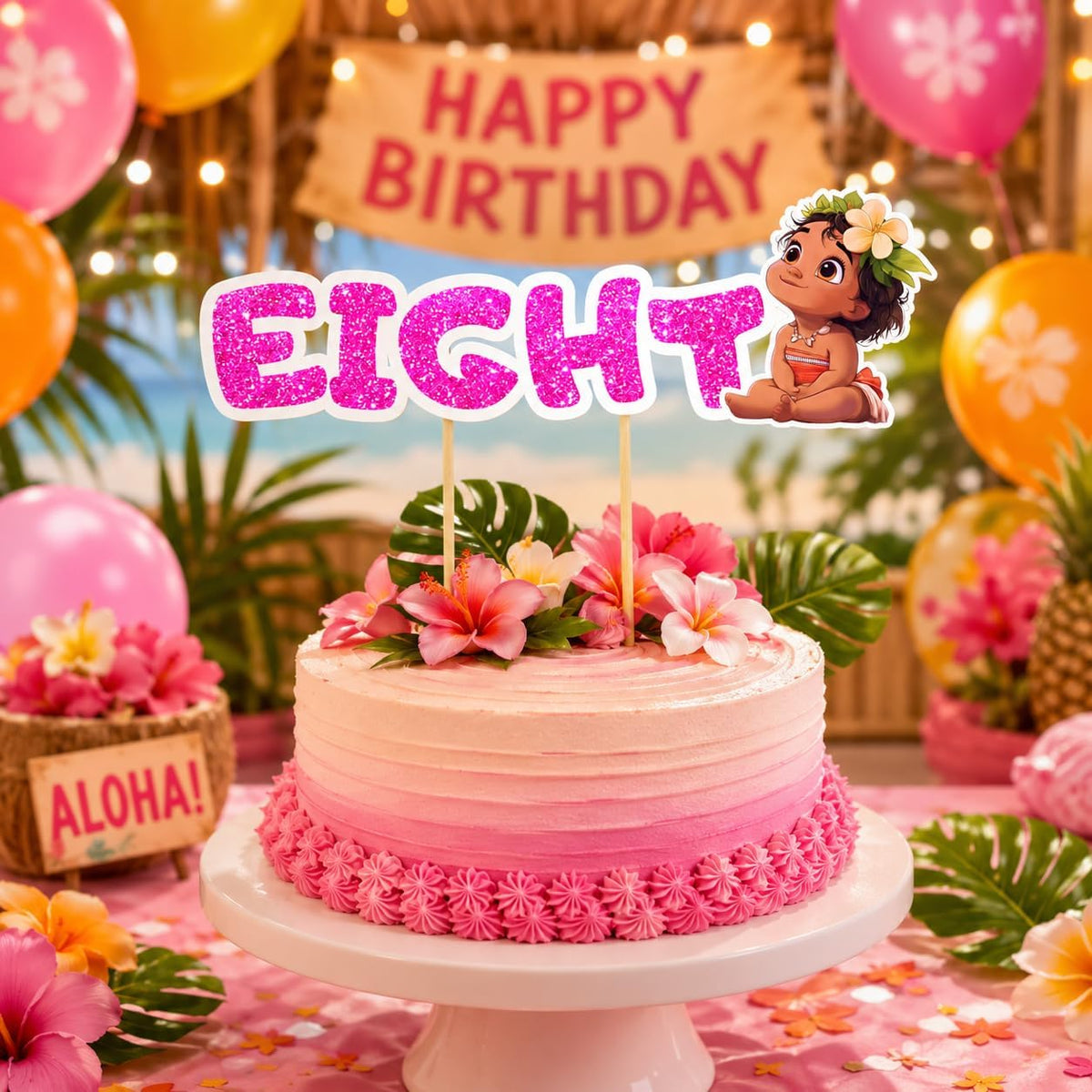 A pink and peach gradient birthday cake on a white pedestal stand, decorated with tropical flowers, green leaves, and a Moana-themed 'EIGHT' topper. The background features a festive tropical party setup with balloons, a 'HAPPY BIRTHDAY' sign, and an 'ALOHA!' planter.