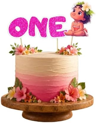 A pastel pink and cream ombre cake on a wooden pedestal stand, decorated with flowers and topped with a glittery pink 'ONE' topper and a cartoon character topper.